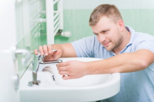 plumber-working-on-bathroom-sink